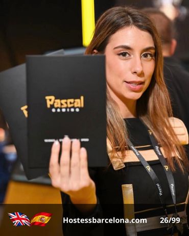 Professional hostess providing visitor support at a large exhibition venue.