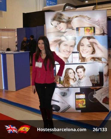 Trade fair hostess ensuring smooth guest reception and information flow.