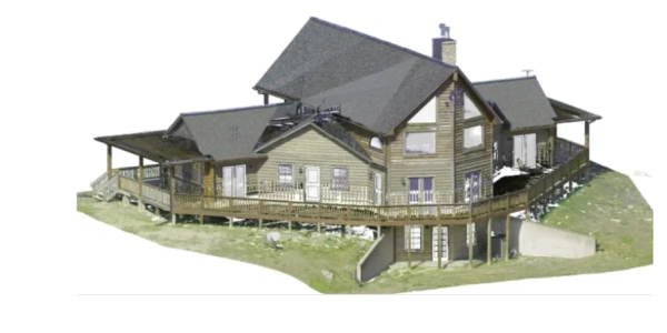 A large wooden house with wrap-around deck on a grassy plot.