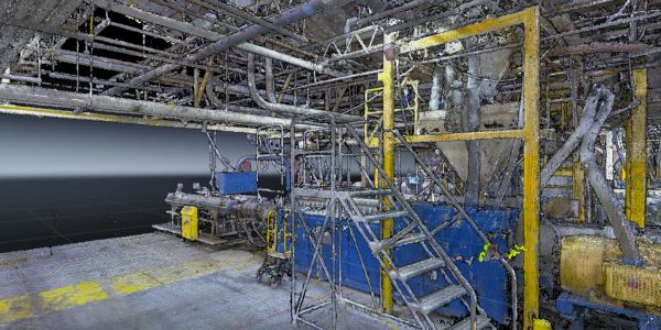 3D industrial facility model with stairs and machinery.