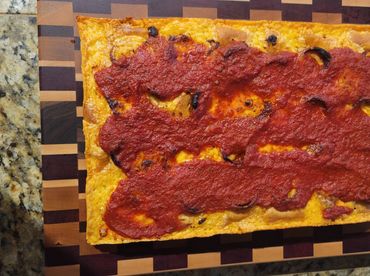 Detroit Pizza just out of the oven on an end grain Unique cutting board