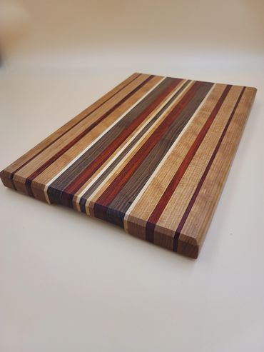Unique cutting board with Cherry, Walnut, Padauk and Maple