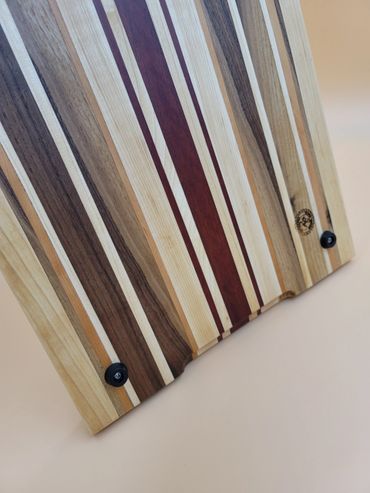 Back of exotic wood cutting board featuring Maple, Walnut, Cherry, Padauk, Curly Maple hardwoods