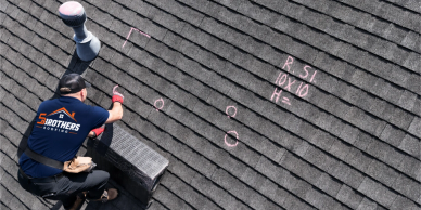 Roofer marking a roof for repair.