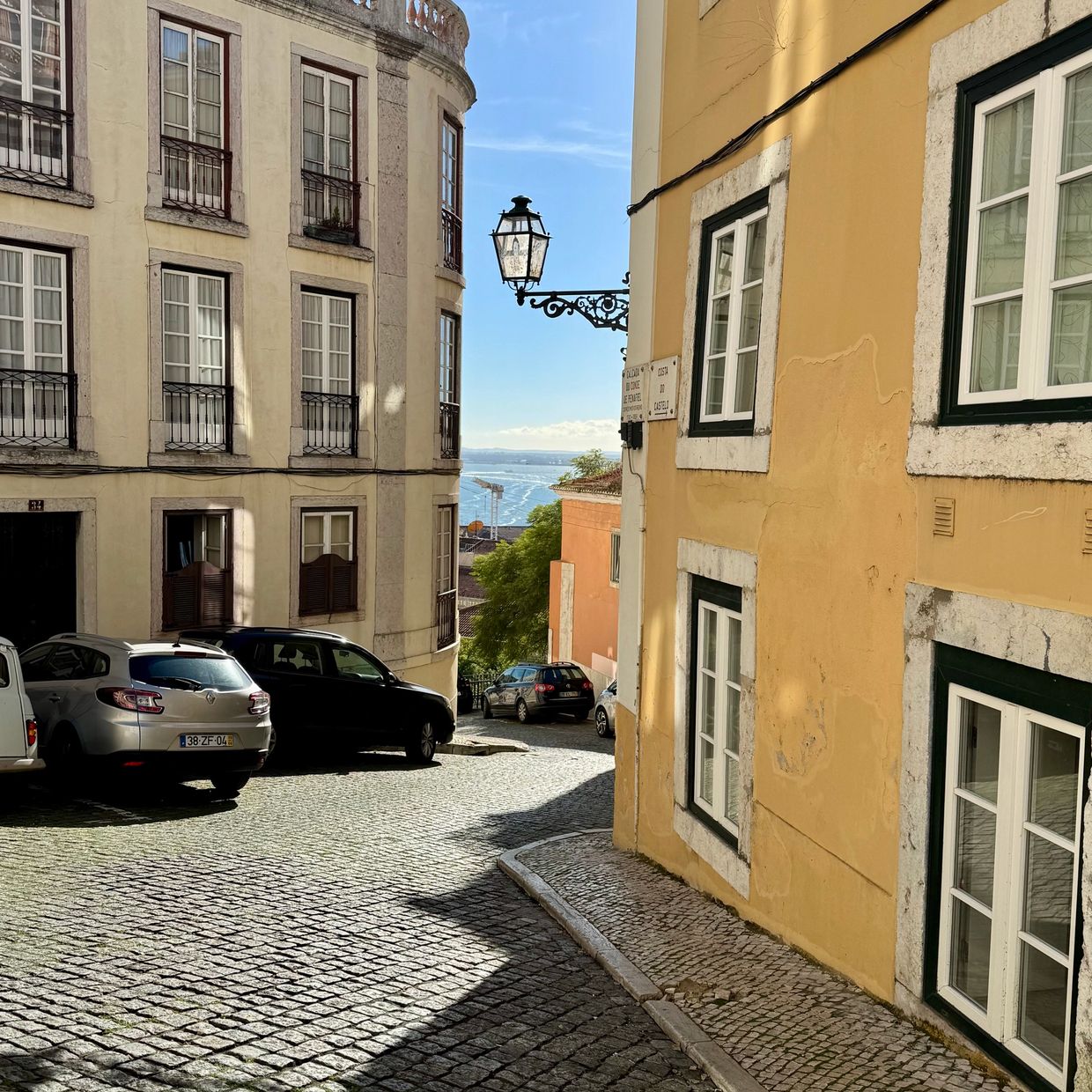 Lisbon's oldest neighborhood, Alfama featuring cobblestone streets and the Tagus River  