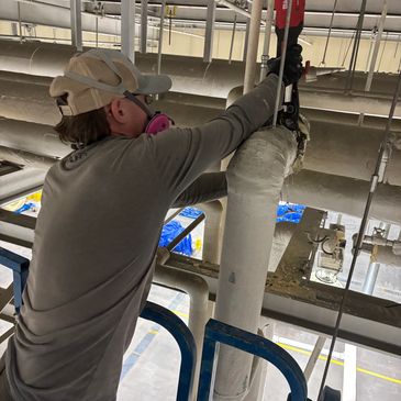 Making a repair on a 3" copper line 30 ft in the air!
