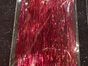 Close-up of shiny red metallic tinsel strands.