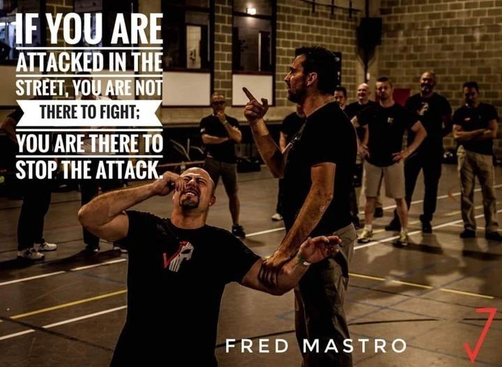 Man defending himself in a street attack training session.