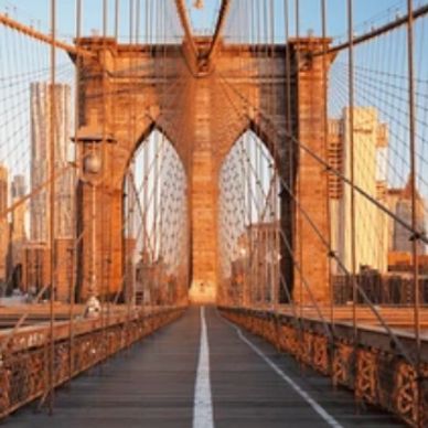 Brooklyn Bridge in warm sunlight.