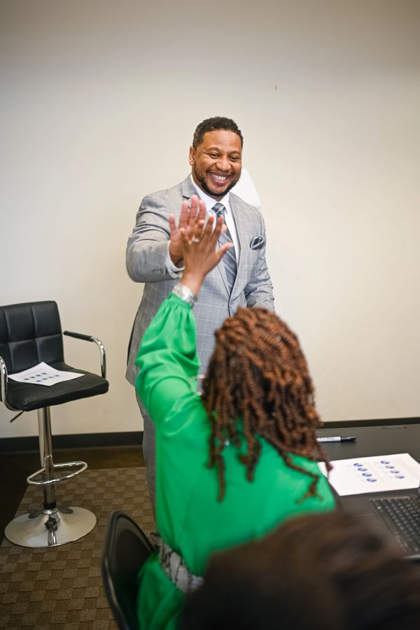 A man giving a high five to a woman 