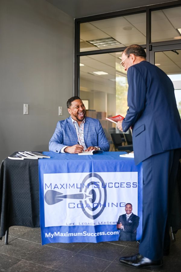 Jerrell Stokley and a man having a fun conversation 