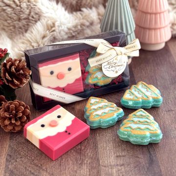 Handcrafted Christmas gift set featuring a Santa soap and Christmas tree bath bombs.