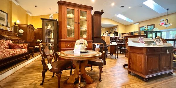 A wide picture of the inside of our 4000 sq. ft. shop showing antique furniture.