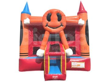 Colorful inflatable bounce house with a smiling sun design and slide.