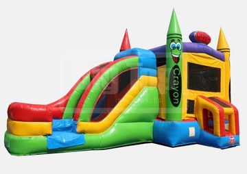 Colorful inflatable bounce house shaped like crayons with a slide.