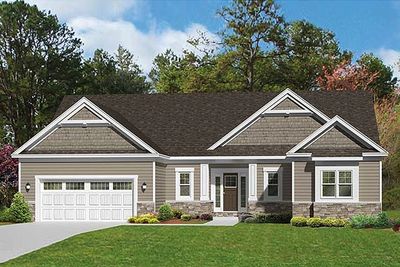 Single-story suburban home with attached garage and well-maintained lawn.