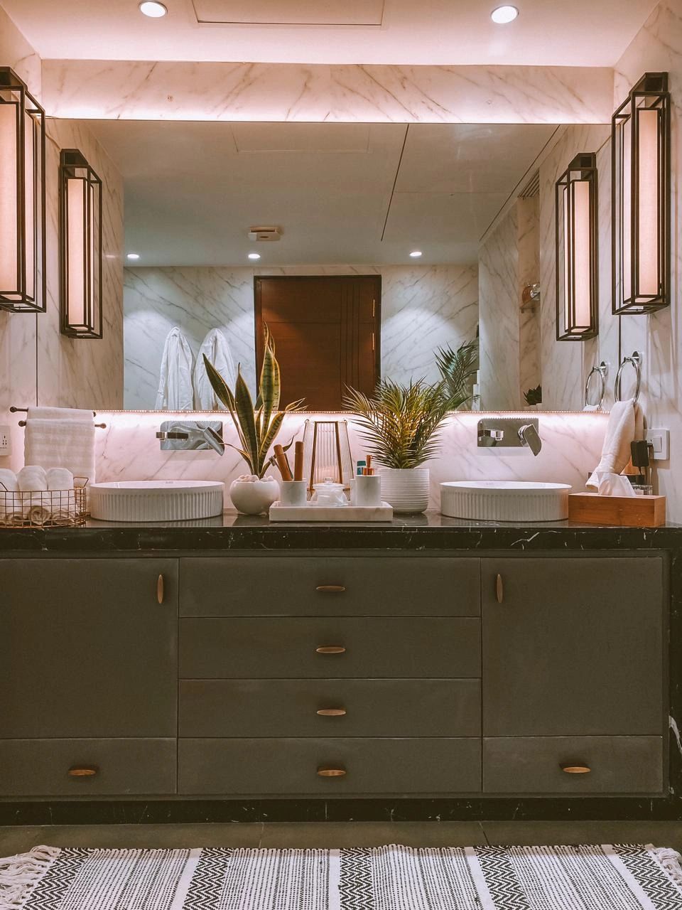 A splash of Carrara marble imparts a luxurious spa-inspired look for this en-suite.