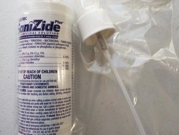 Close up of a SaniZide Bottle in a plastic bag.