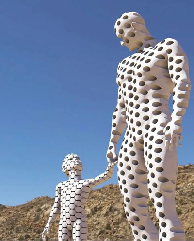 A statue with manhole hand with child