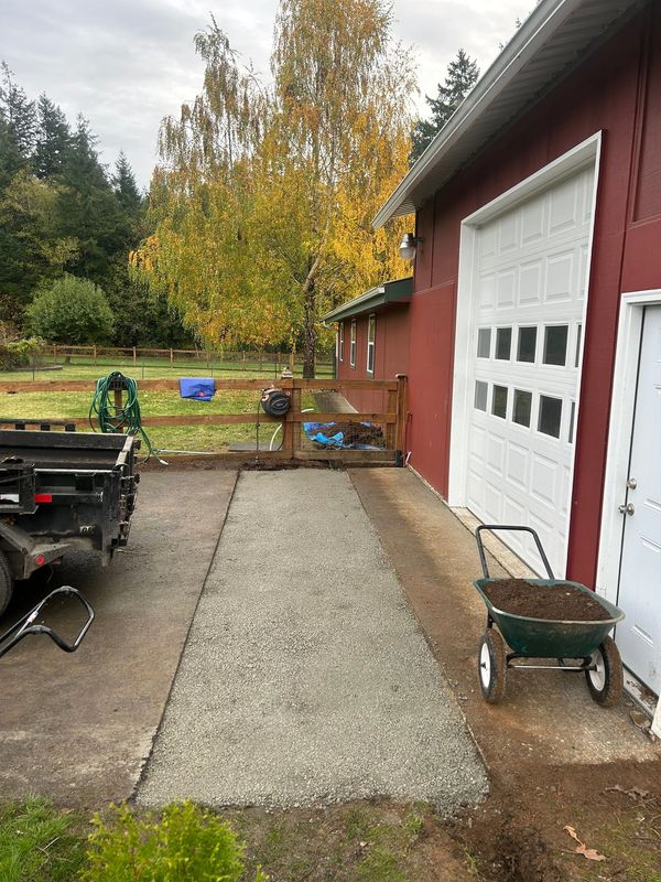 Long narrow section of driveway needs asphalt replaced after having plumbing repairs completed.