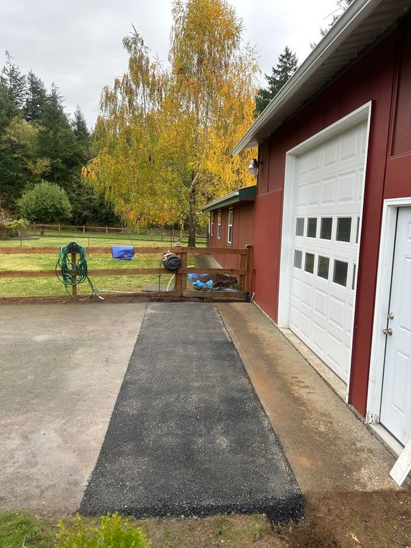 Completed asphalt repair after plumbing repairs.
