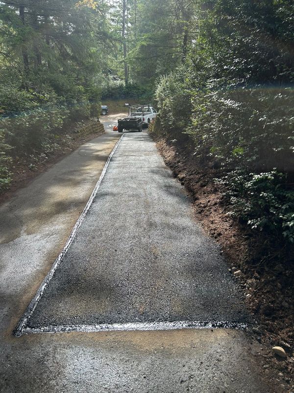 Completed asphalt patch on a long driveway in Port Orchard, WA.