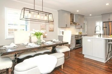 Dark hardwood floors creating a warm and inviting atmosphere.