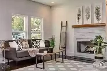 Built-in shelving on both sides of the fireplace providing storage and display space.