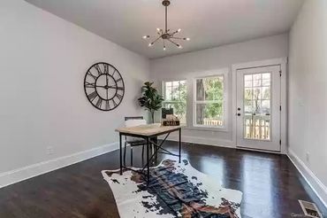 Unique cowhide rug adding texture and visual interest to the space.