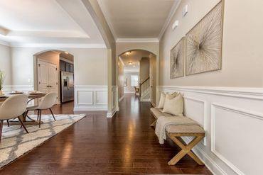Two arched doorways leading to other rooms, creating a sense of flow and openness.