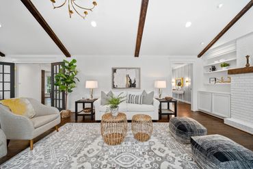 Large patterned rug defining the seating area.