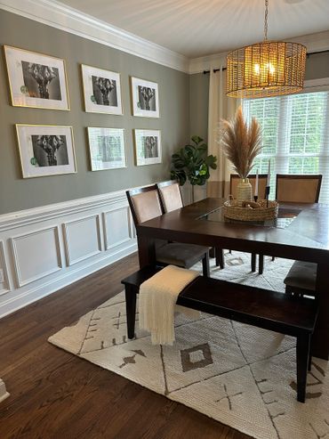 Modern dining room with dark wood furniture.