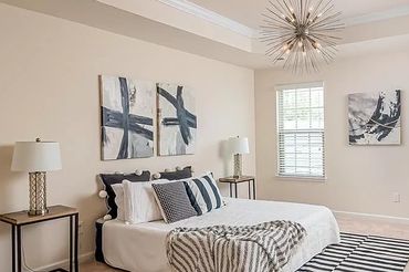 Modern bedroom design with a focus on clean lines and a minimalist aesthetic.