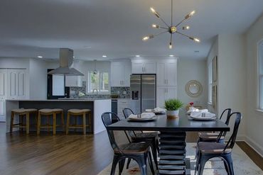 Dining room with kitchen view in [Address or Neighborhood], [City, State].