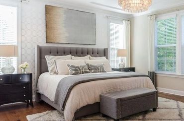 Contemporary bedroom with a mix of textures and patterns.