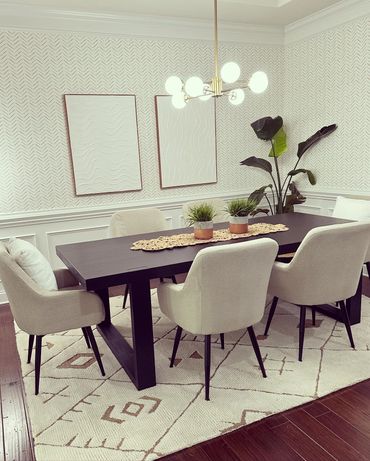 Contemporary dining room with a statement light fixture.
