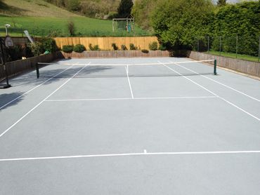 A light blue tennis court