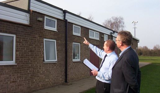 Meeting the then chair of the parish council to discuss repairs required to the village hall roof.