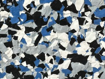Multicolor rubber floor with black, white, blue, and gray flakes.