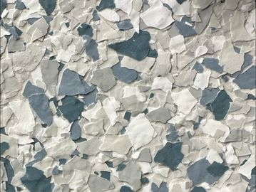 Close-up of a textured surface with irregular shapes in white, gray, and blue.