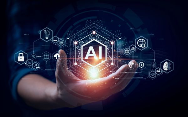 Hand holding glowing AI technology interface
