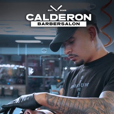 Barber carefully trims a client's beard in Calderon Barbersalon.
