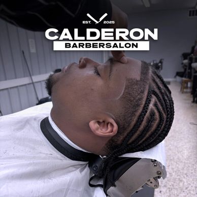 Man with fresh cornrow braids and a clean haircut at Calderon Barbersalon.