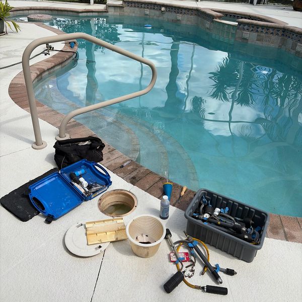 Leak detection equipment set up beside a residential pool in Broward County, Florida.