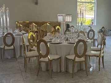 If you want something a little different than the traditional Chiavari, our gold O-back chairs are i