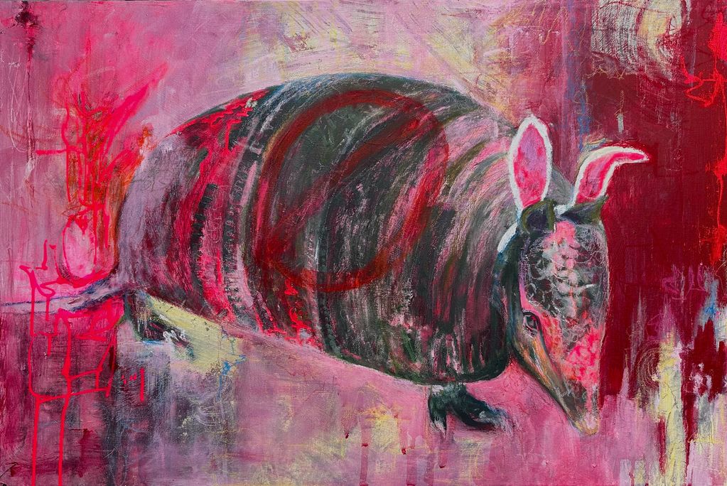 Abstract painting of an armadillo with vibrant red and pink hues.