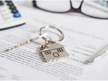 House document with keys and pen