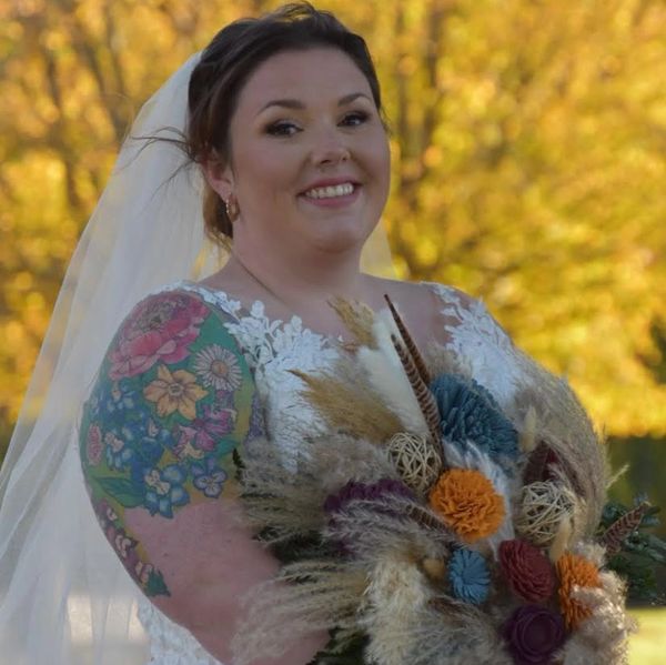 Smiling bride holding boho-style wood flower bouquet

Photo credit: Sarah B Photography