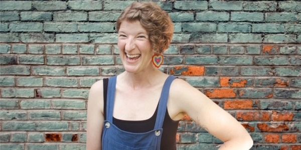 Alt Text: Smiling woman with hand on her hip.

Photo Credit: Patrick Mead