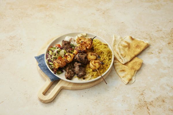 Mixed platter with kafta, lamb, chicken and prawn skewers, hummus, salads and bread